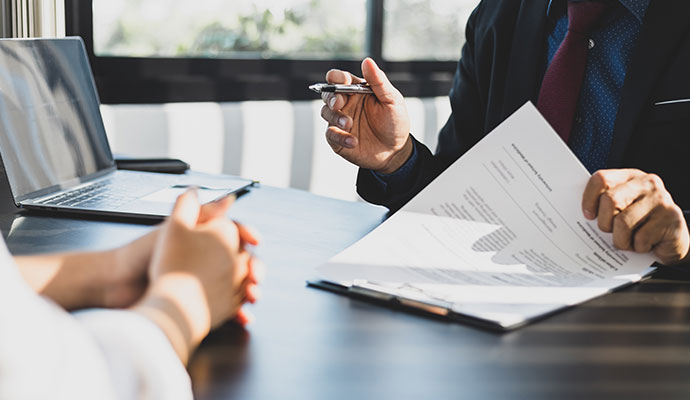 Agent explaining liability policy to client