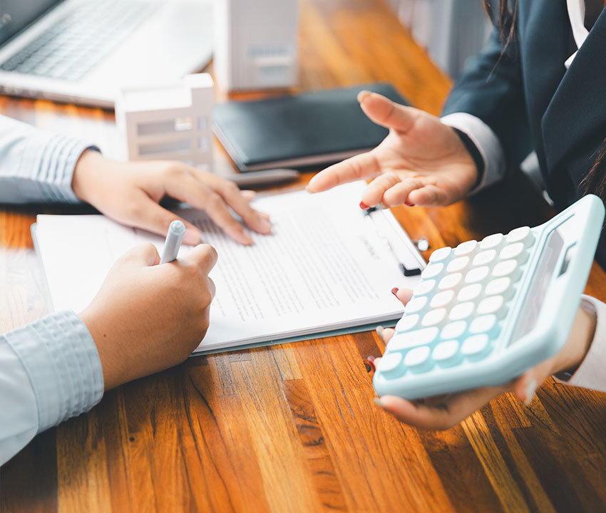 Business Insurance Consultation in Texas Two business professionals reviewing insurance documents