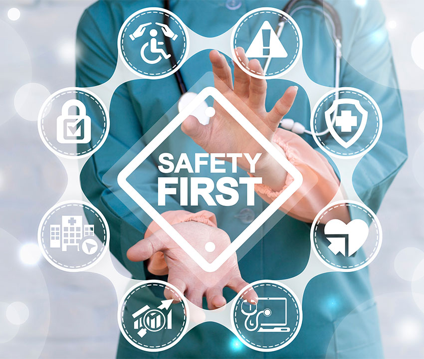 Doctor offers safety first sign on virtual screen. Doctor offers safety first sign on virtual screen.