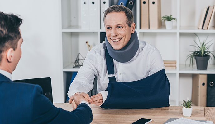 Business injury insurance consultation Insurance advisor discussing coverage with an injured business client