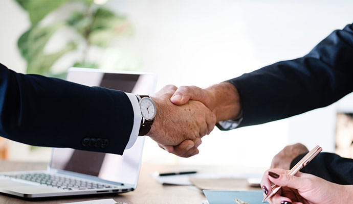 Business professionals handshake insurance agreement