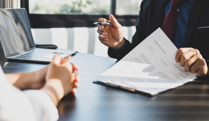 Businessman talking to insurance adjuster