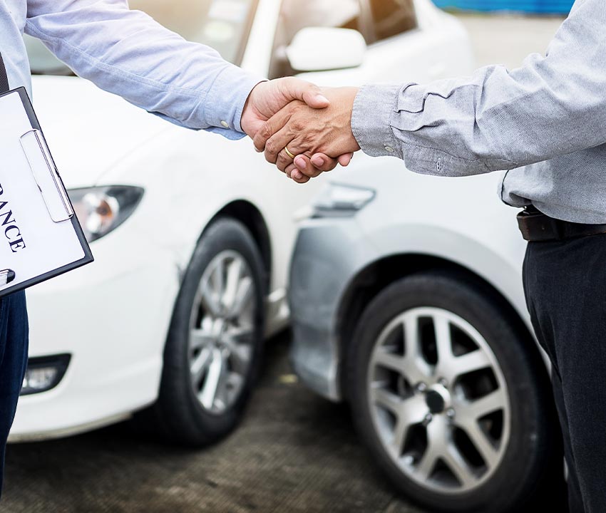 Customer and insurance agent hand shaking