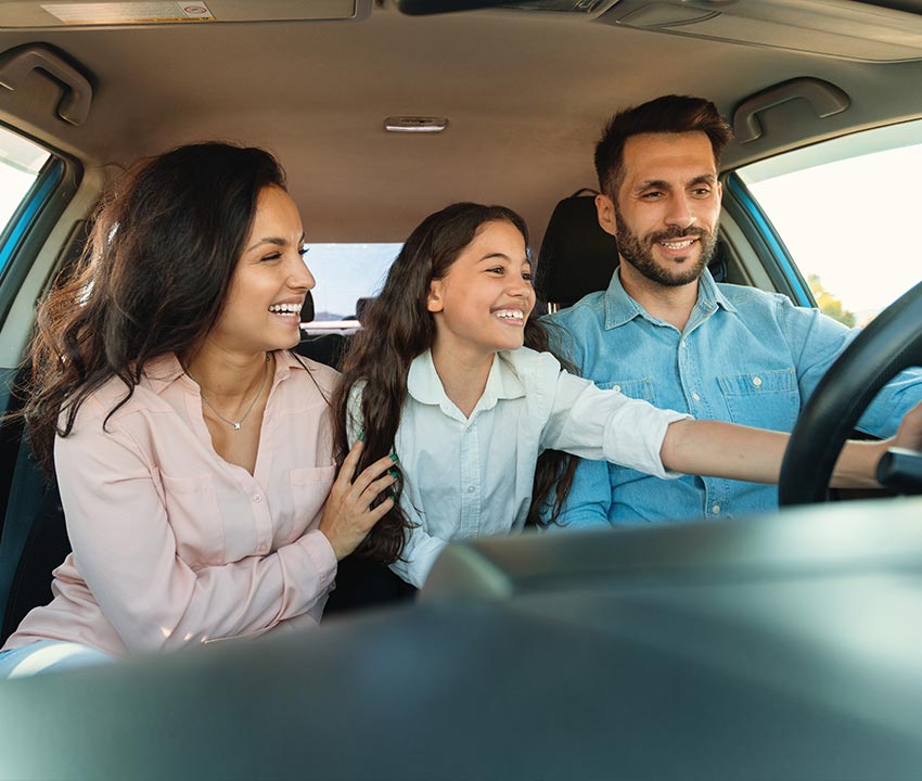 Family enjoying their brand new car