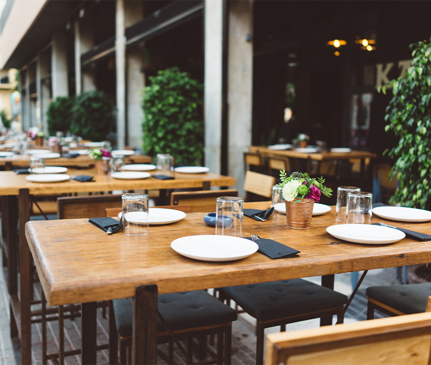 dish on the wooden table in outdoor restaurant