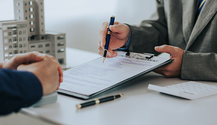 Insurance advisor reviewing excess liability coverage with a business client