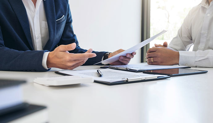 Insurance advisor discussing business coverage options