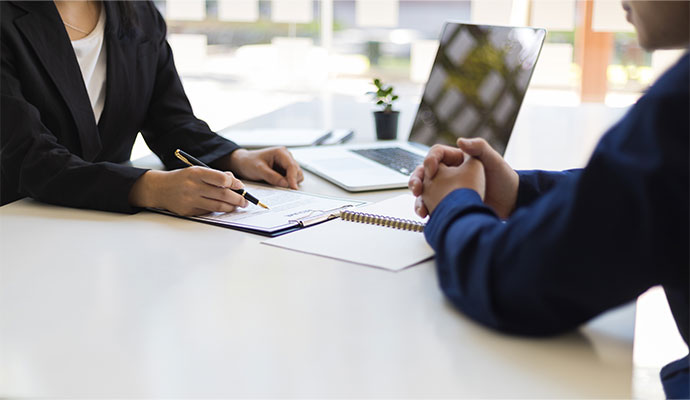 Quote Texas Insurance agent reviewing policy terms with client