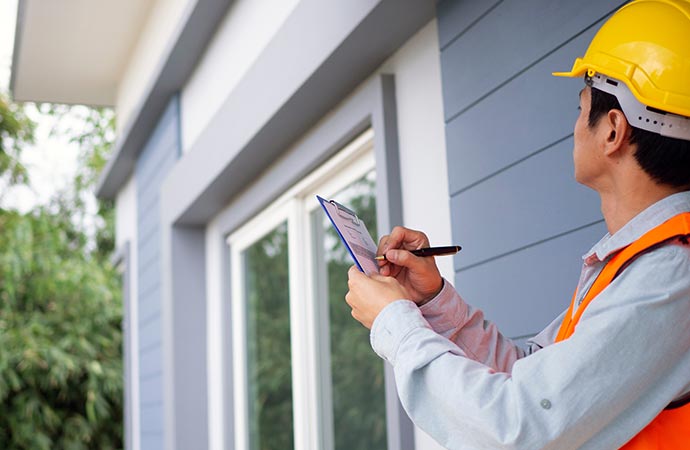 worker inspecting home