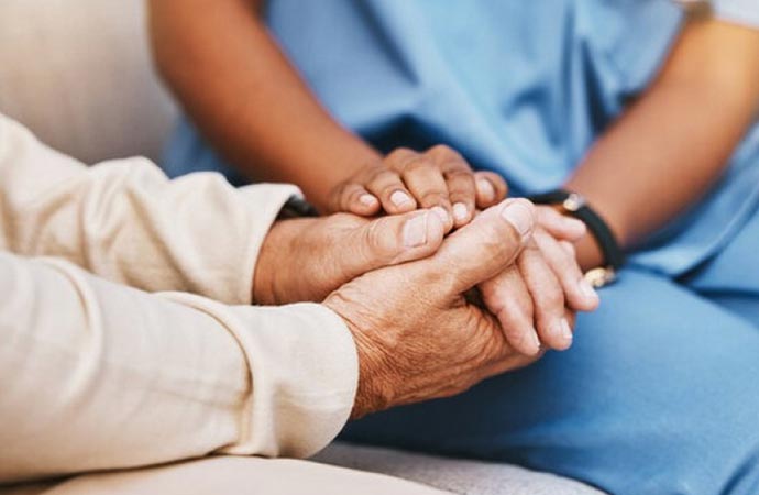 a nurse assisting a patient