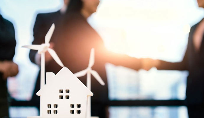 Renewable energy business professionals shaking hands