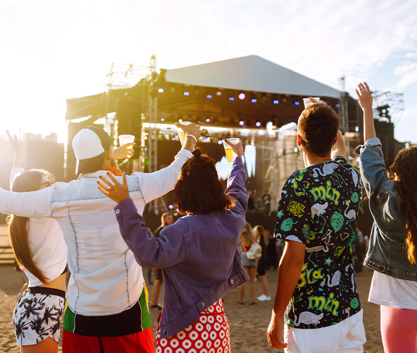 Large Crowd at a Texas Festival With Food Stalls and Live Music